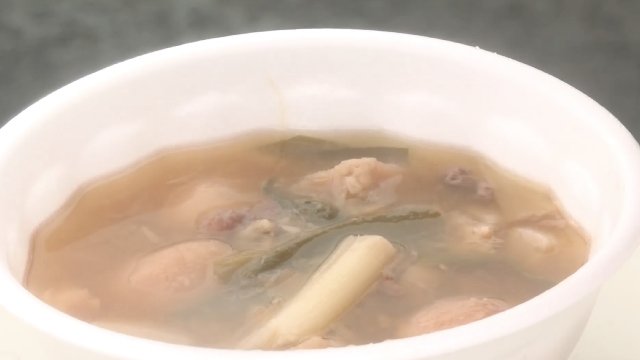 Potato stew cooked in giant pot served at outdoor event in Yamagata