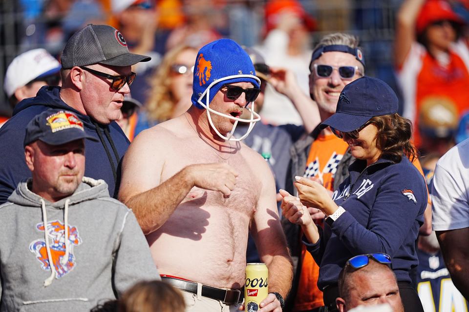 Oct 13, 2024; Denver, Colorado, USA; A Denver Broncos fan in the second half against the Los Angeles Chargers at Empower Field at Mile High. Mandatory Credit: Ron Chenoy-Imagn Images