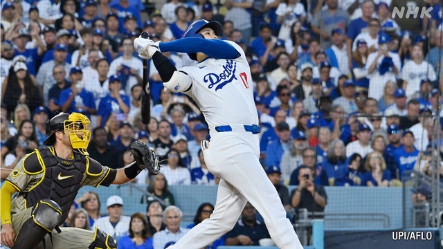 Dodgers, Ohtani fight back for first playoff win