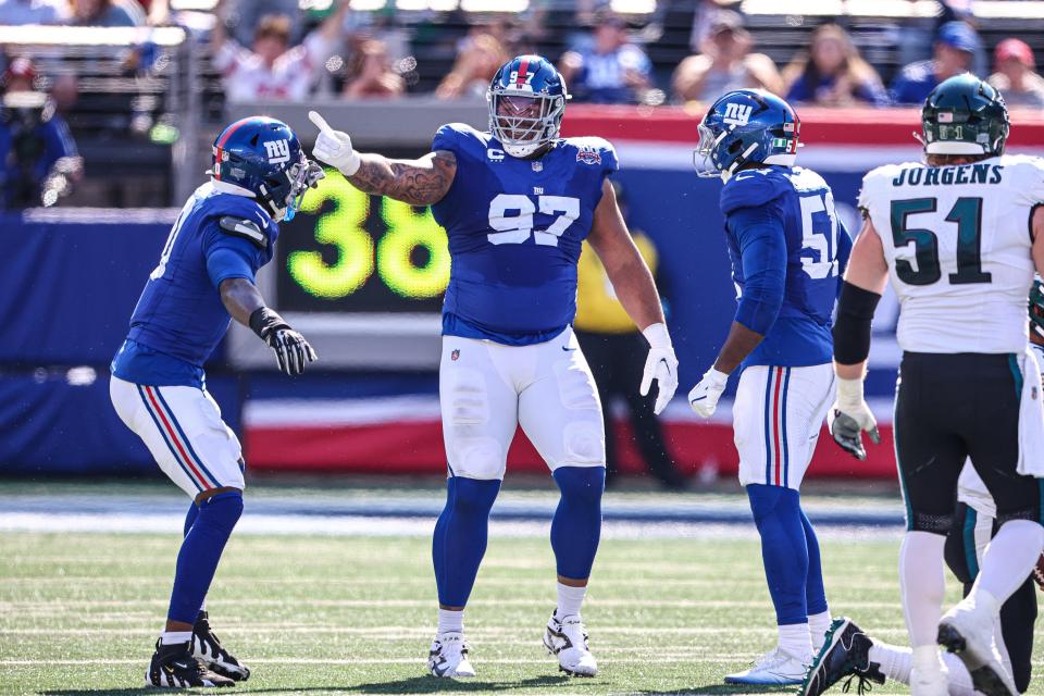 Oct 20, 2024; East Rutherford, New Jersey, USA; New York Giants defensive tackle Dexter Lawrence II (97) celebrates after a sack during the first half against the Philadelphia Eagles at MetLife Stadium. Mandatory Credit: Vincent Carchietta-Imagn Images