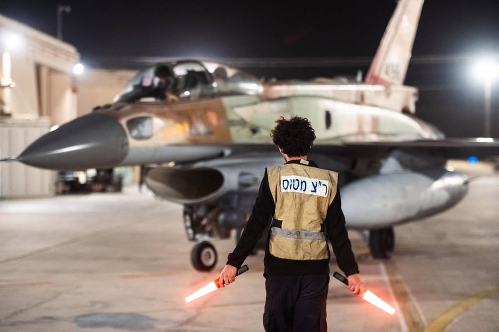 An armed Israeli warplane departs from an unknown location to attack Iran on Saturday. Photo: Israeli Army via AP