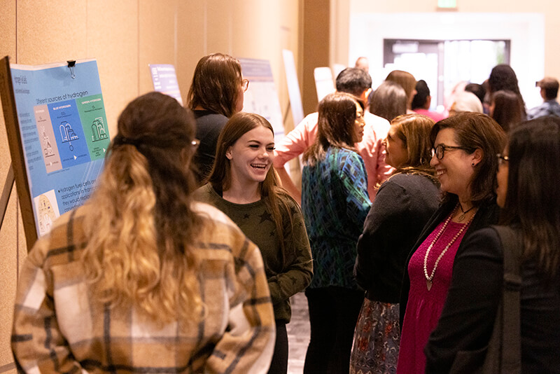 Alexia Rodriguez, left, and Jordan Kennedy, center, speak with Shanna Charles.