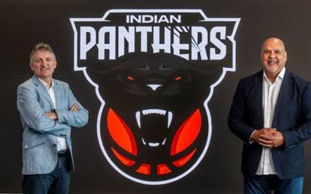 Sky's Justin Nelson, left, and InBL Pro chief executive Parveen Batish show the Indian Panthers logo.