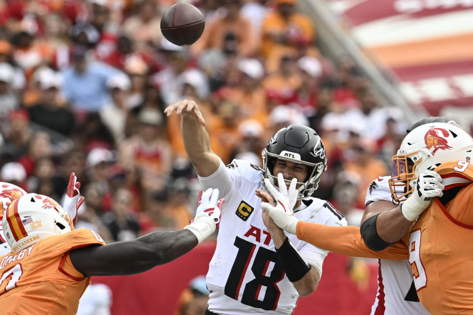 Kirk Cousins fought through a Tampa Bay defense to throw four touchdowns. (AP Photo/Jason Behnken)