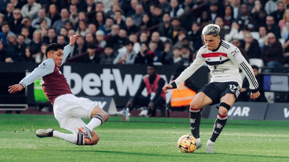 West Ham's Edson Alvarez challenges Manchester United's Alejandro Garnacho for the ball