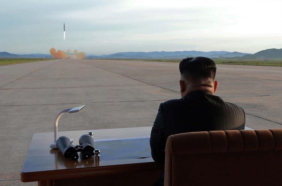 This undated picture released from North Korea's official Korean Central News Agency (KCNA) on September 16, 2017 shows North Korean leader Kim Jong-Un inspecting a launching drill of the medium-and-long range strategic ballistic rocket Hwasong-12 at an undisclosed location.