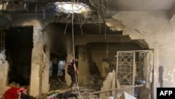 A man inspects the damage in a house that was hit in an Israeli airstrike in the eastern Lebanese city of Baalbek in the Bekaa valley on Oct. 21, 2024.