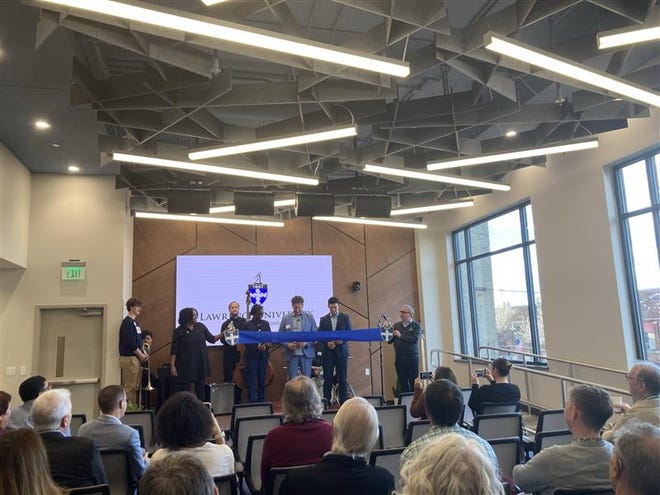 At Wednesday's Business & Entrepreneurship Center ribbon cutting, Lawrence University President Laurie Carter (third from the left) is joined by Professor Adam Galambos (middle), student Nico Manzanera (second from the right) and Provost Peter Blitstein (right). The center is located in Fox Commons, 10 W. College Ave., in Appleton.