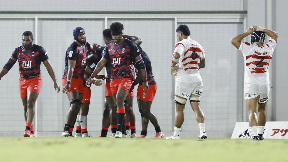 Celebrating Fiji players.