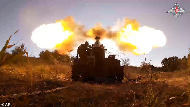 Russian soldiers fire a Giatsint-S gun toward Ukrainian positions near Kursk