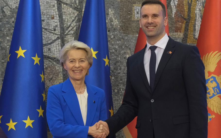 Montenegro’s Prime Minister Milojko Spajic, right, shakes hands with European Commission President Ursula von der Leyen in Podgorica, Montenegro, Saturday, Oct. 26, 2024.