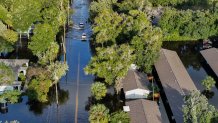 In this aerial view, vehicles drive through flood waters after Hurricane Helene hit the area as it passed offshore on September 27, 2024 in Crystal River, Florida.