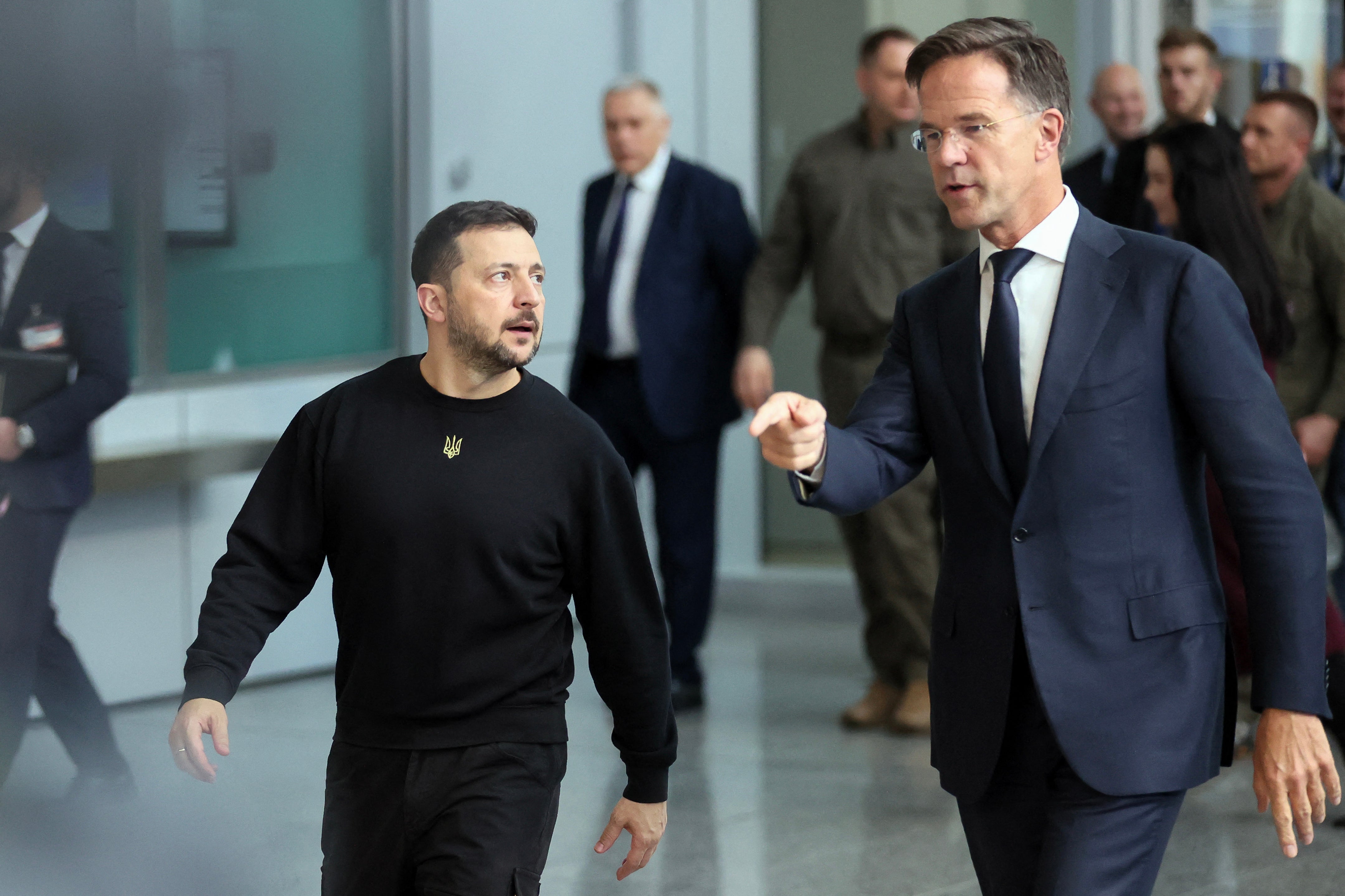 Nato chief Mark Rutte walks flanked by Ukraine’s president Volodymyr Zelensky at Nato headquarters in Brussels