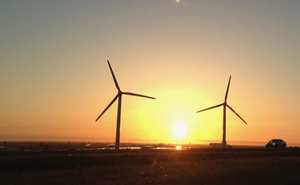 wind turbines at sunset