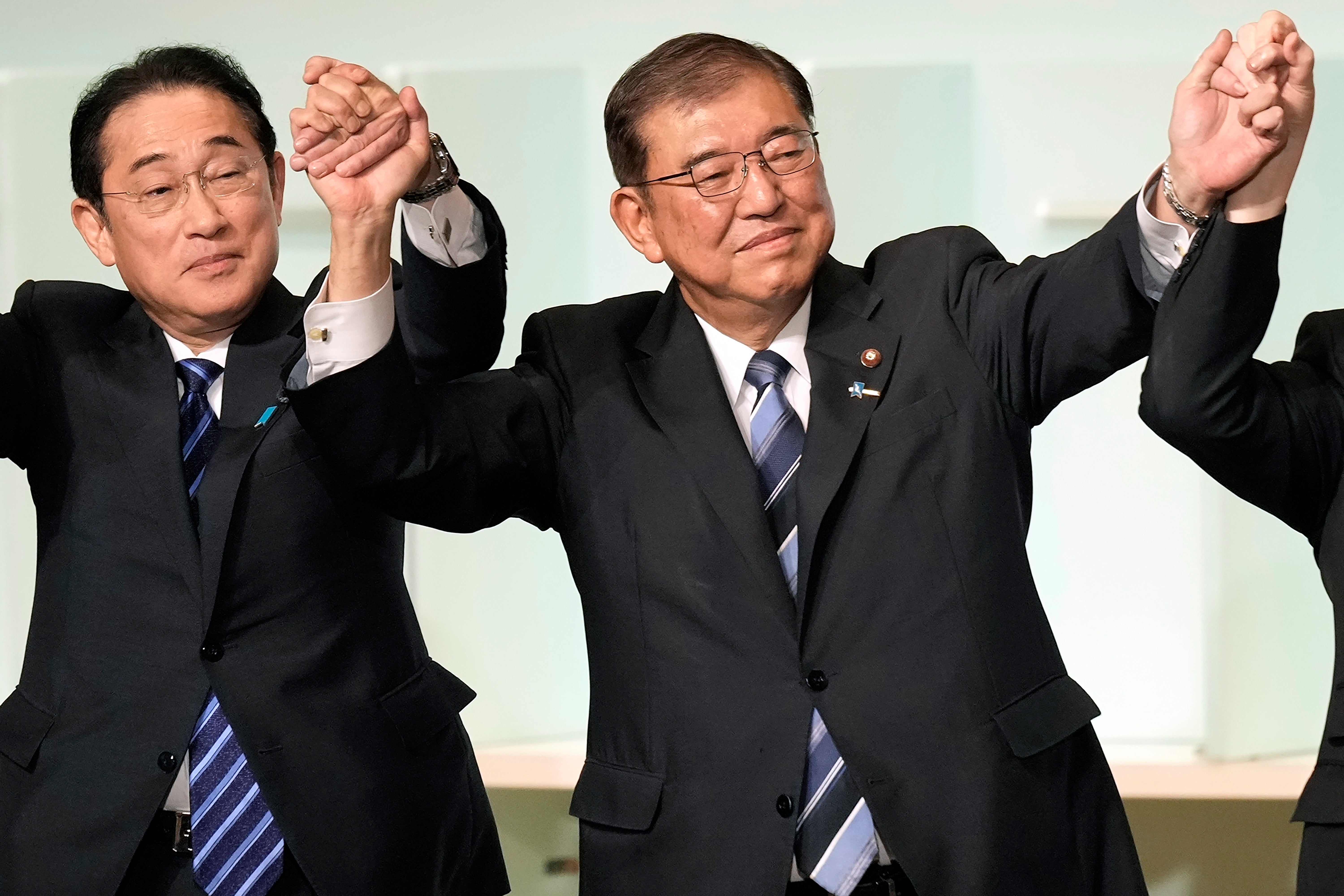 Fumio Kishida, left, resigned as prime minister over the slush fund scandal, even though he was not directly implicated, such was the reputational damage to his party