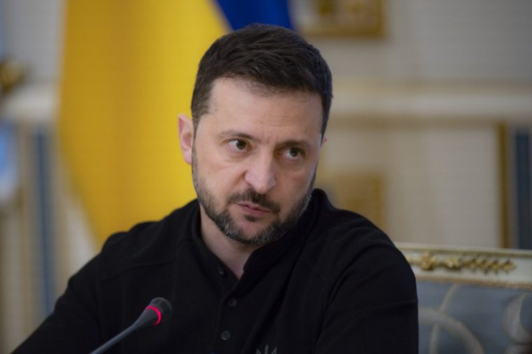 In this photo provided by the Ukrainian Presidential Press Office, Ukrainian President Volodymyr Zelenskyy talks with Ukrainian journalists in Kyiv, Ukraine, Monday, Oct. 21, 2024. (Ukrainian Presidential Press Office via AP)