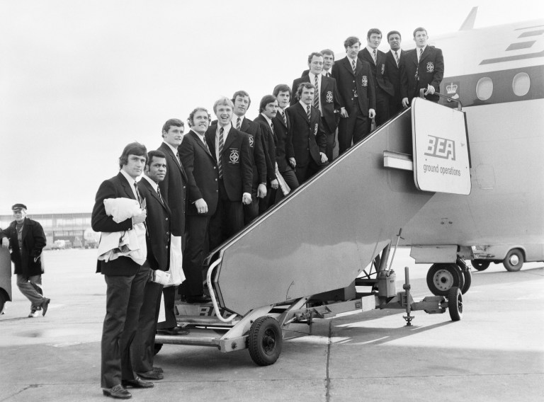 The Great Britain Rugby Team standing on the steps leading onto a plane at Manchester Airport – on their way to Paris to compete in The Rugby World Cup.