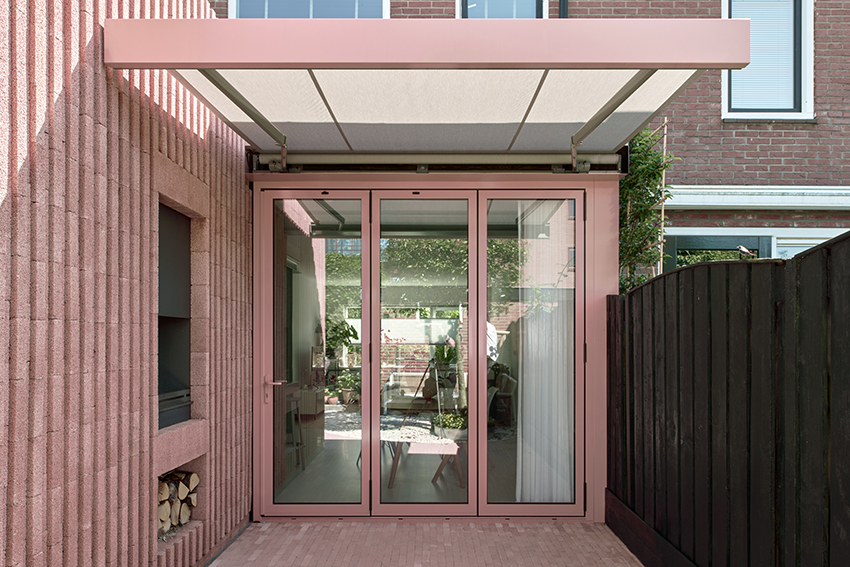 vertical pink concrete bricks wrap atlas architects' rosa home in the netherlands