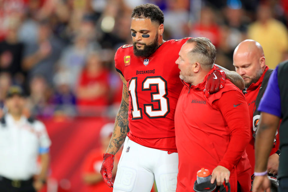 TAMPA, FL - OCTOBER 21: Tampa Bay Buccaneers wide receiver Mike Evans (13) is helped off the field during the game between the Baltimore Ravens and the Tampa Bay Buccaneers on October 21, 2024 at Raymond James Stadium in Tampa, Florida. (Photo by Cliff Welch/Icon Sportswire via Getty Images)