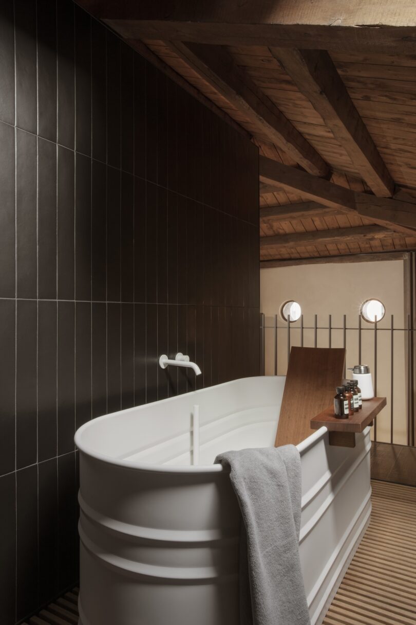 A bathroom with a white freestanding tub