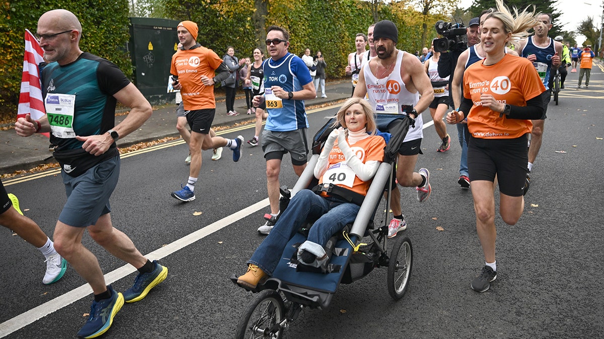 Colin Farrell runs the Dublin marathon with Emma Fogarty