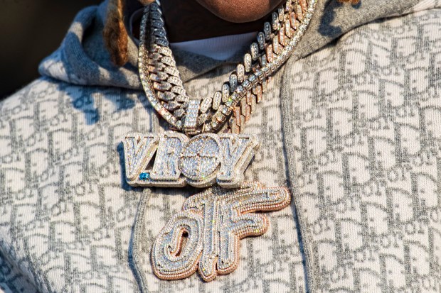 Lil Durk wears a pendent dedicated to his friend, fellow rapper King Von, as he performs at Lyrical Lemonade Summer Smash at Douglass Park on Aug. 22, 2021. (Vashon Jordan Jr./Chicago Tribune)