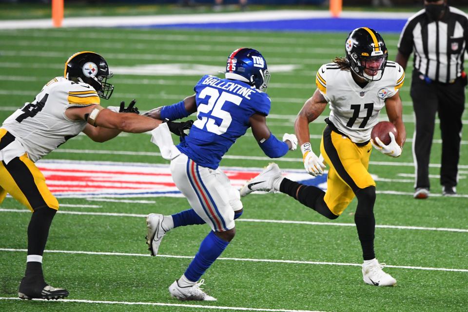 Sep 14, 2020; East Rutherford, New Jersey, USA; Pittsburgh Steelers wide receiver Chase Claypool (11) runs the ball past New York Giants cornerback Corey Ballentine (25) during the fourth quarter at MetLife Stadium. Mandatory Credit: Robert Deutsch-USA TODAY Sports