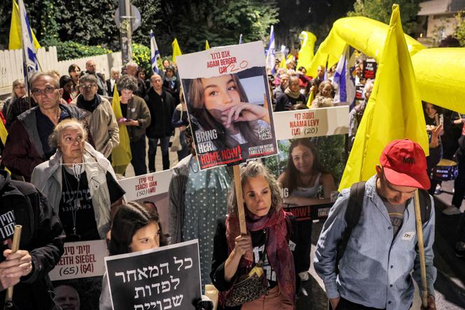 Protesters stand with portraits of Israeli hostages Agam Berger (20), Naama Levy (20), and others during a demonstration by the families of the hostages taken captive in the Gaza Strip by Palestinian militants during the October 7, 2023 attacks, calling for action to release the hostages, outside the Israeli Prime Minister's residence in Azza (Gaza) Street in central Jerusalem on October 24, 2024 amid Israel's ongoing war with Hamas.  (Photo by Ahmad GHARABLI / AFP)