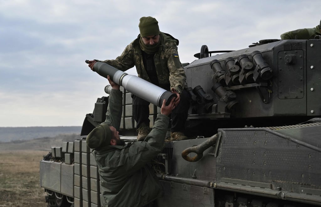 Tankers from the 33rd separate mechanised brigade of the Ukrainian Ground Forces fire with a Leopard 2A4 tank at an undisclosed location in Ukraine on Sunday. Photo: AFP