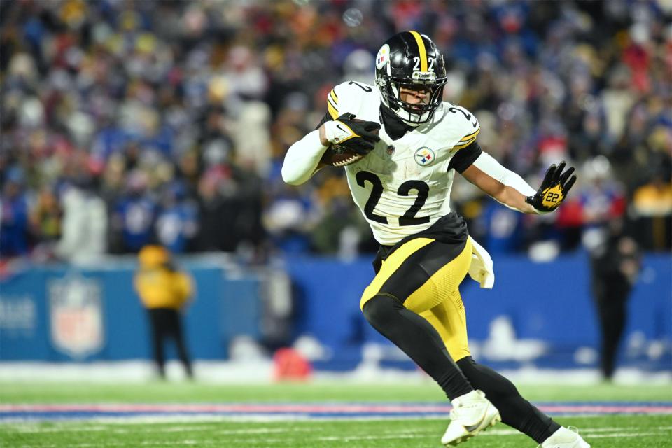 Jan 15, 2024; Orchard Park, New York, USA; Pittsburgh Steelers running back Najee Harris (22) runs the ball in the first half against the Buffalo Bills in a 2024 AFC wild card game at Highmark Stadium. Mandatory Credit: Mark Konezny-USA TODAY Sports