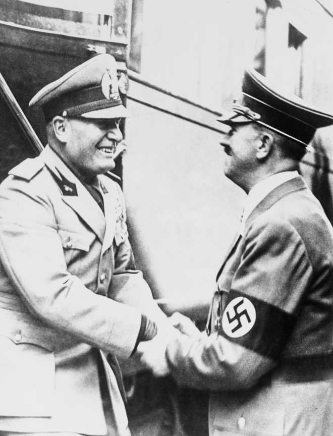 Adolf Hitler (1889-1945) warmly greets Benito Mussolini (1883-1945) on the latter's arrival at Kufstein on the way to Munich, 29 September 1938. (Photo by Daily Herald Archive/National Science &amp; Media Museum/SSPL via Getty Images)