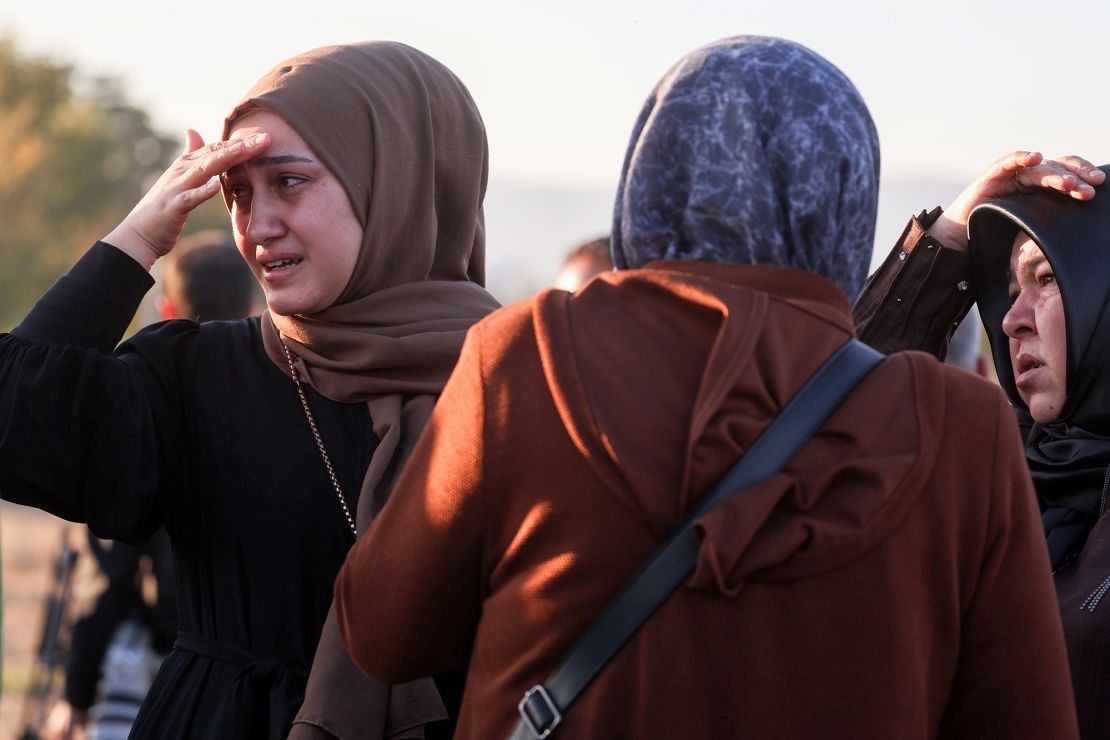 Relatives of employees look on following an attack on a state-run aerospace company near Ankara.