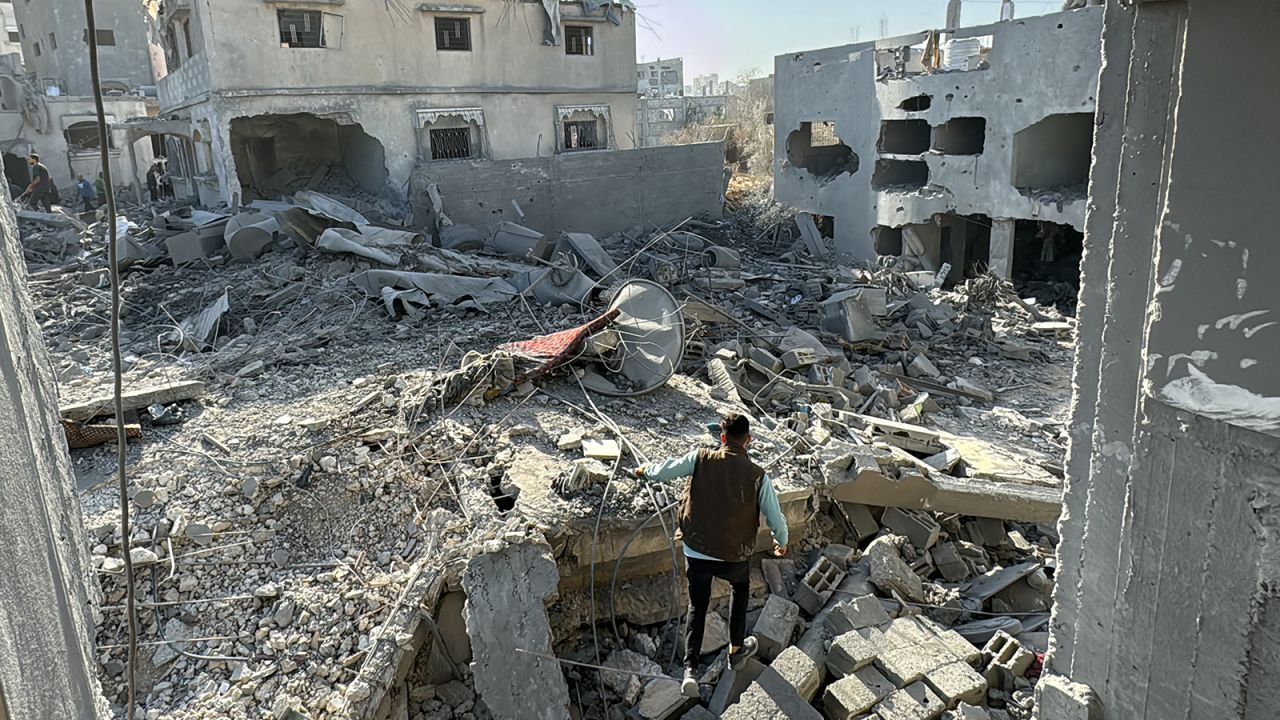 A Palestinian inspects the damage after an overnight Israeli airstrike in Beit Lahia, northern Gaza, on October 27.