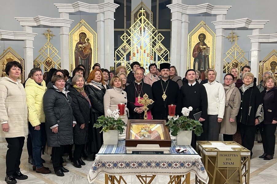 Archbishop William E. Lori of Baltimore poses with a group of people in Ukraine.