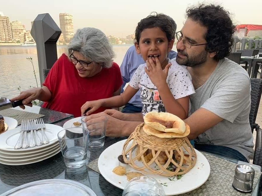 Laila celebrates her 63rd birthday alongside her son Alaa and her grandson Khaled in Cairo, Egypt, in May 2019, months before Mr Fattah was arrested again