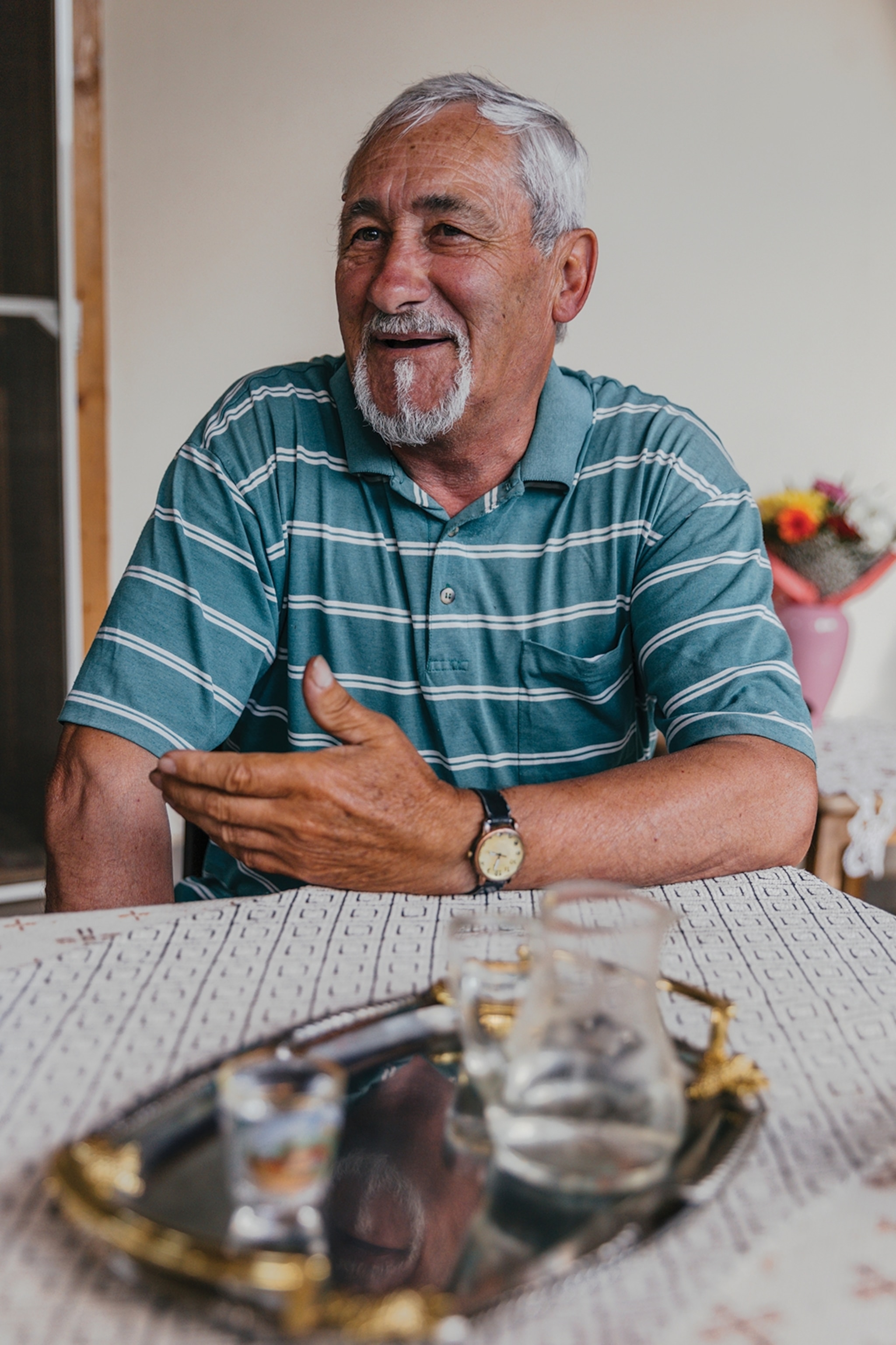 Alexandru Băcișor sitting at a kitchen table