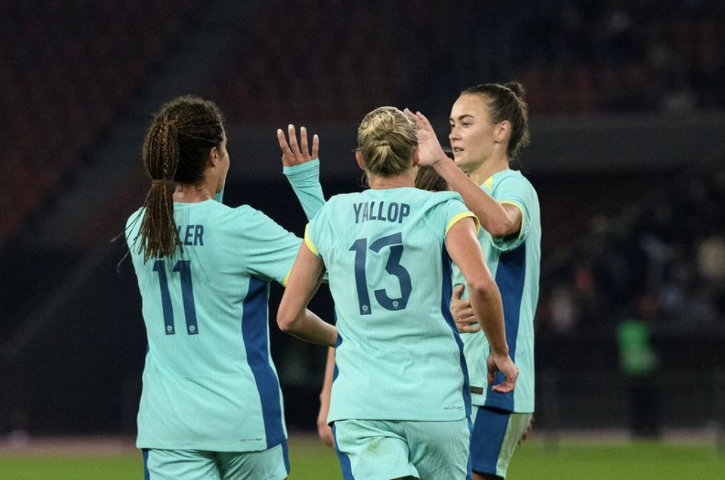 Mary Fowler, Caitlin Foord and Tameka Yallop celebrate Foord's goal v Switzerland - Marcio Marcado